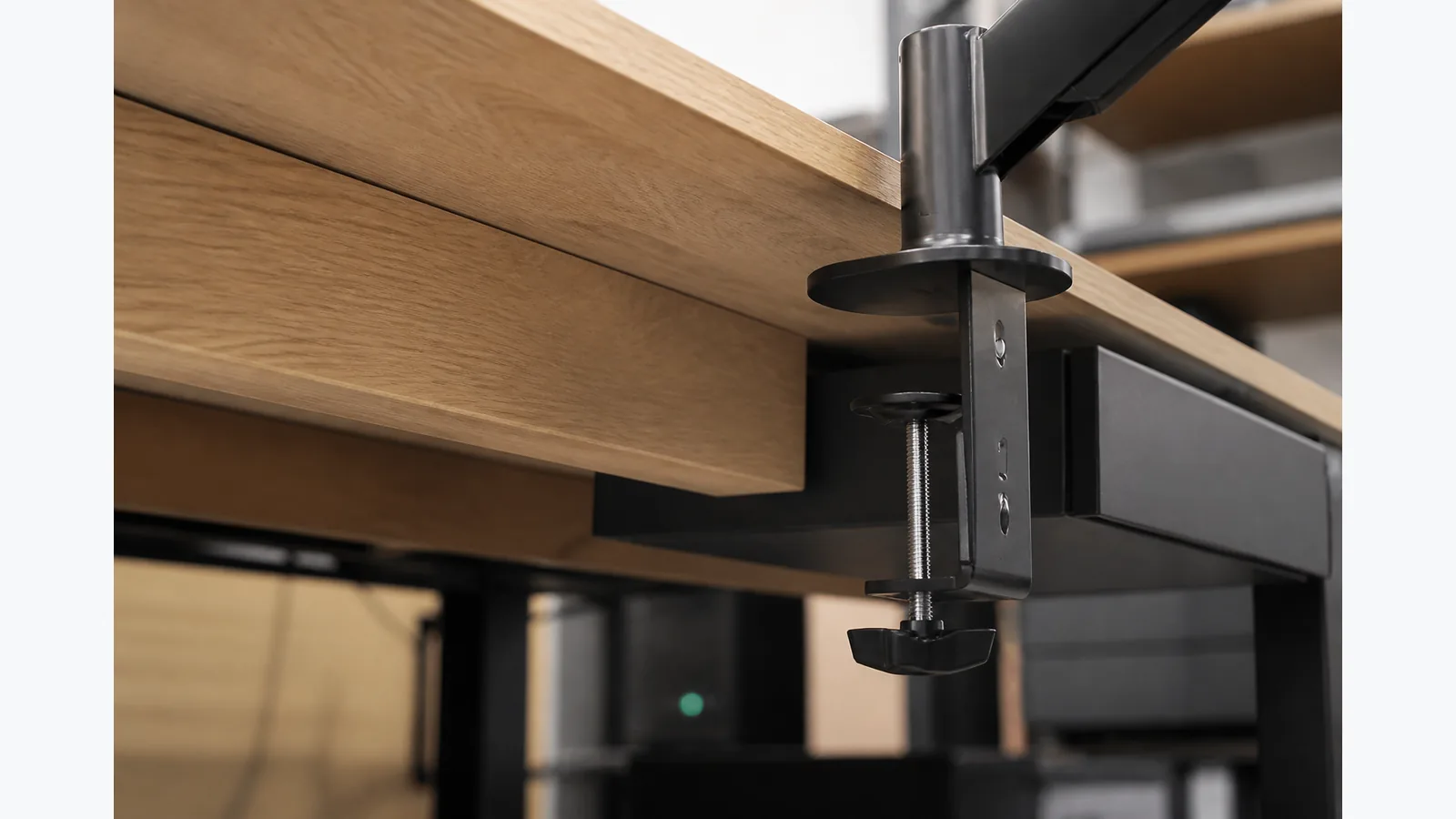 Common desk obstructions that stop a monitor arm clamp fitting